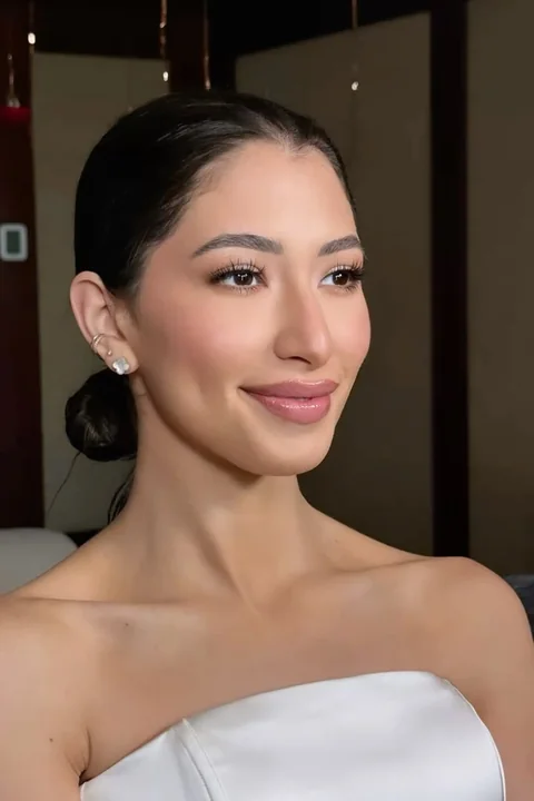 Soft matte bridal makeup — serene profile portrait of a bride before the ceremony