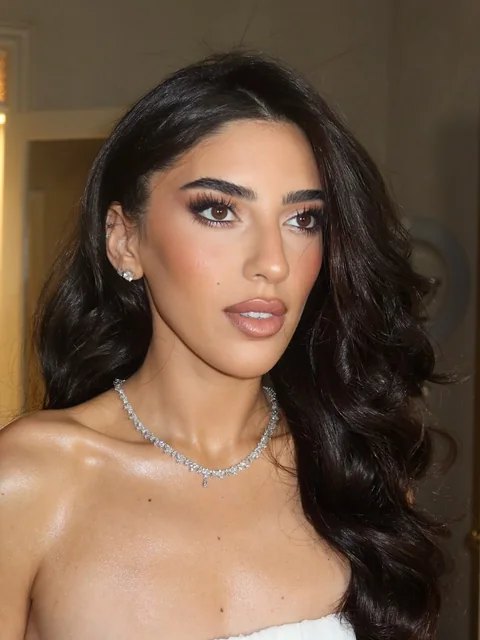 Bride with cascading waves and a diamond necklace — evening bridal glam by Aya Abdelhamid