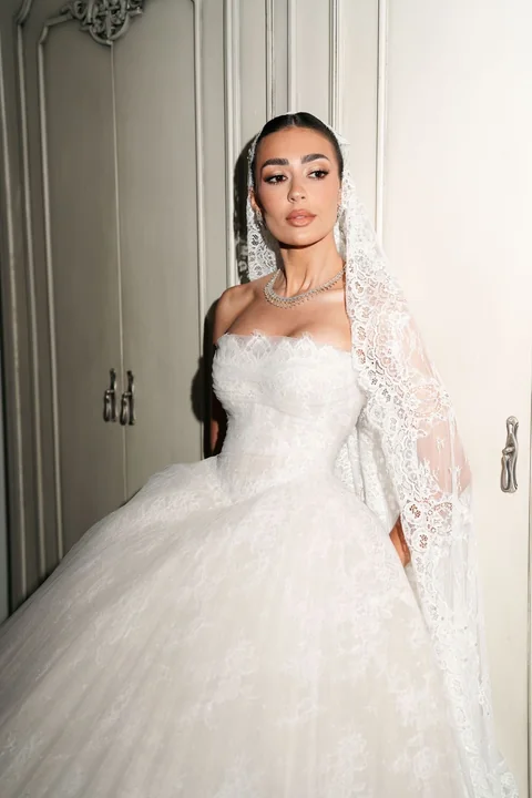 Bride in a couture ball gown and embellished veil — editorial bridal beauty