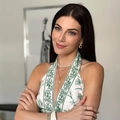 Fresh porcelain-skin celebrity look with an emerald-print gown