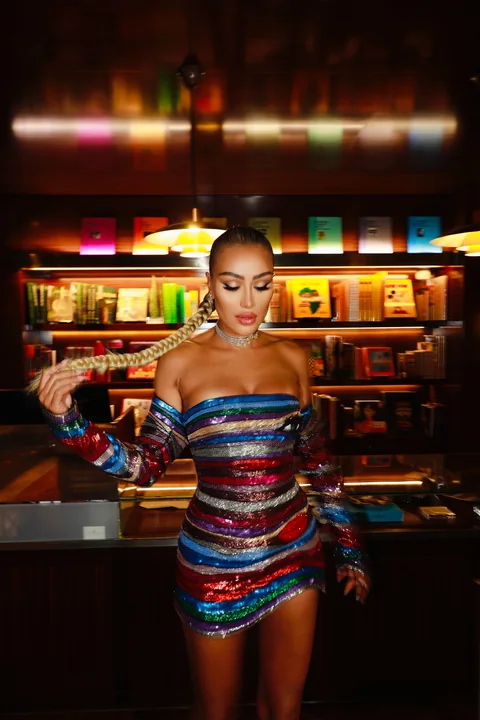 High-shine party makeup in a metallic mini dress — celebrity nightlife beauty