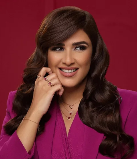Magenta press-day portrait — warm bronze glam with soft waves